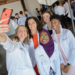 Members of the Class of 2025 Pose for a Selfie after the Ceremony