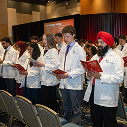 To close the ceremony, the new students recited The Physician's Pledge.