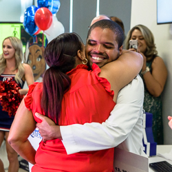 Alvarez Hugs His Mother at the Ceremony