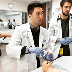 George Van Nguyen with a Fellow Student in the Sim Center