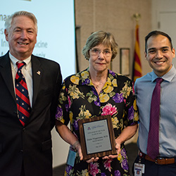 Dr. Niggemann with Her Award (Middle)