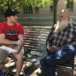 street medicine student with homeless man