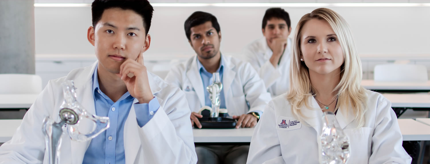 four medical students in a classroom