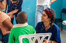 Tina Samsamshariat examining a patient during a Global Health trip to Mexico