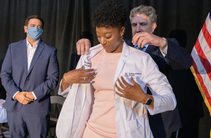 A First-Year Medical Student is Coated during the White Coat Ceremony