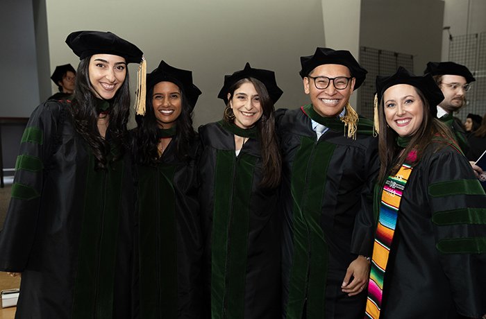 Medical students pose for a picture at their commencement ceremony