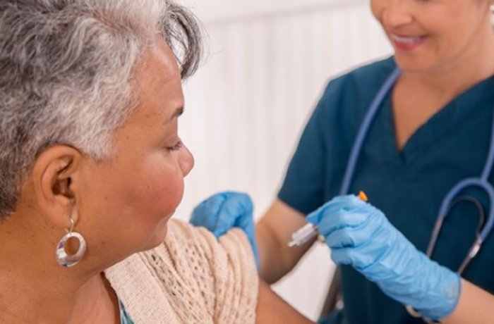 Nurse Administering the Flu Shot to a Patient