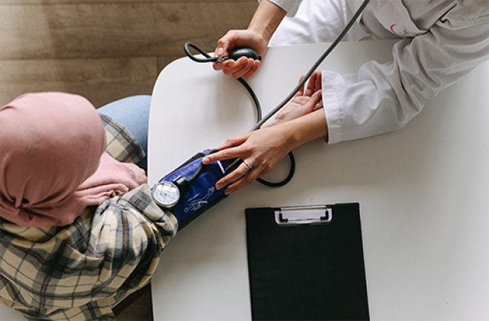 A doctor administering a blood pressure check