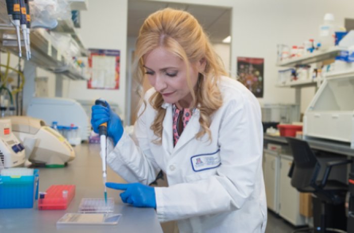 Dr. Herbst-Kralovetz Working in Her Lab