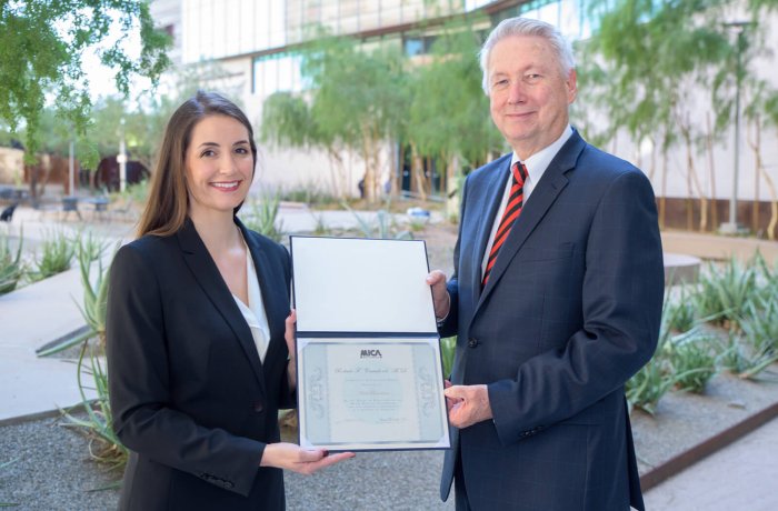 Nicole Boardman, pictured with Dean Guy Reed, received the Robert F. Crawford, MD, Scholastic Achievement Award