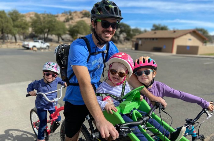 Matt Evans, MD, taking his kids for a bike ride