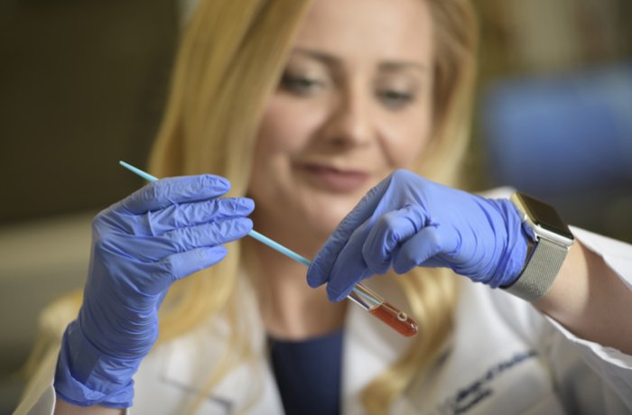 Dr. Herbst-Kralovetz examines vaginal bacteria in her lab