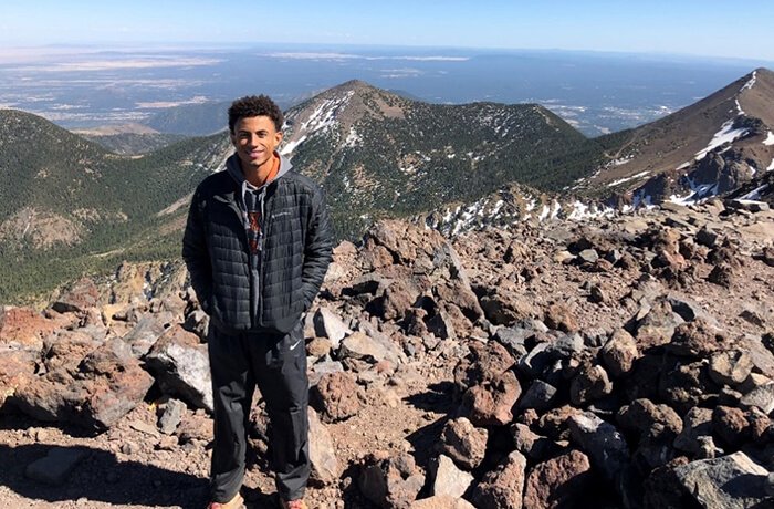 Brandon Klor on top of Mt. Humphreys in Flagstaff, Ariz.