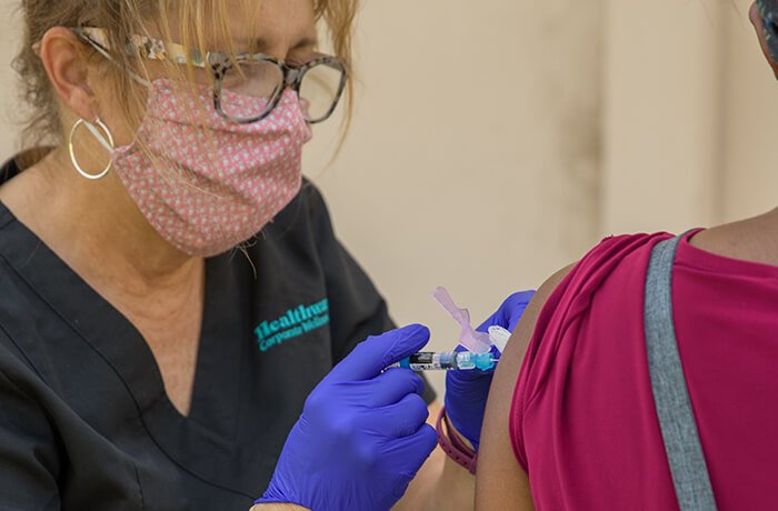 A Nurse Administers a Flu Shot