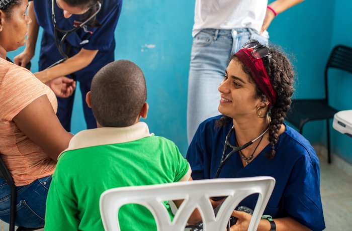 Tina Samsamshariat examining a patient during a Global Health trip