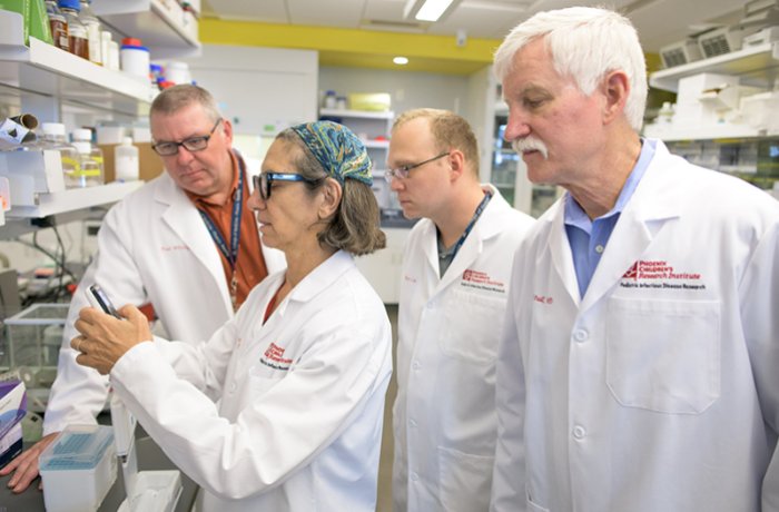 Terrence Stull, MD, with His Team in the Lab