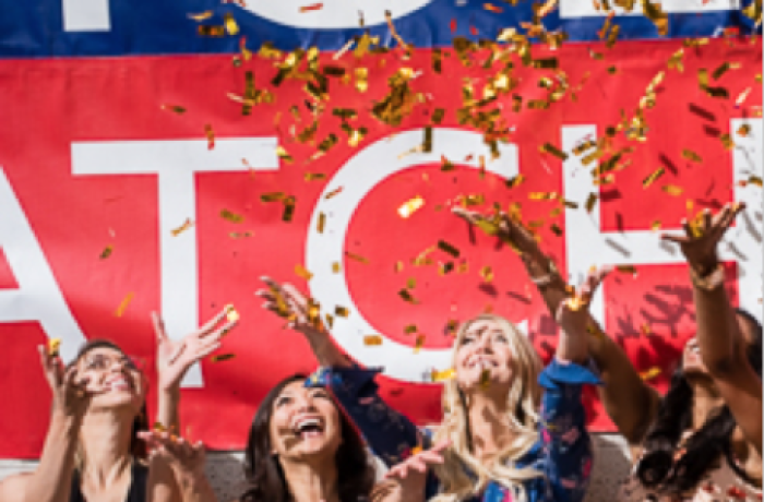 Four Medical Students Toss Confetti in the Air at Match Day 