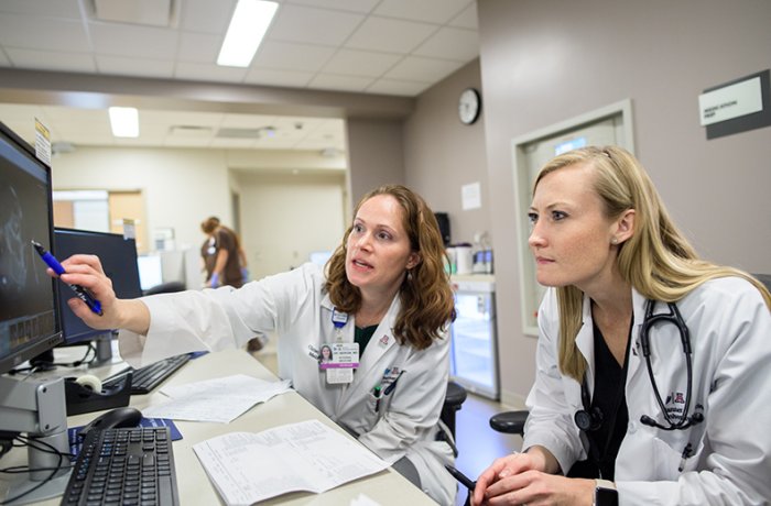 Dr. Christina Bergin Works with a Resident at Banner