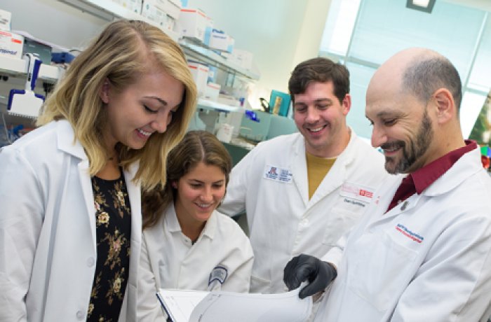 Graduate Students in the Lab Looking over Notes