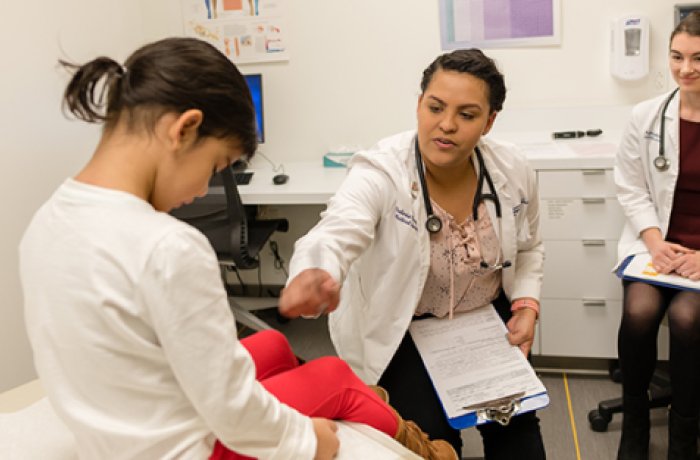 Students in the Doctoring Suite with a Pediatric Patient
