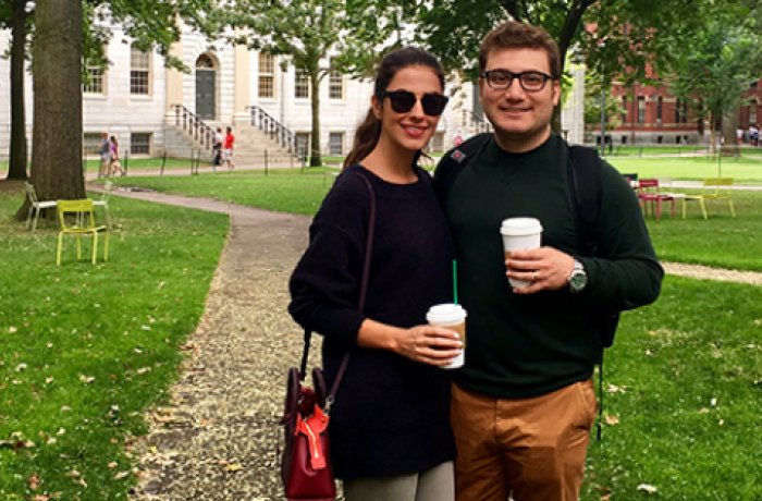 Amir Kaboodrangi and a friend posing with to-go coffee cups