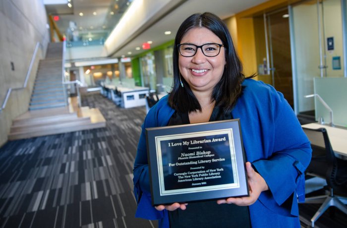 Naomi Bishop Holding Her "I Love My Librarian" Award