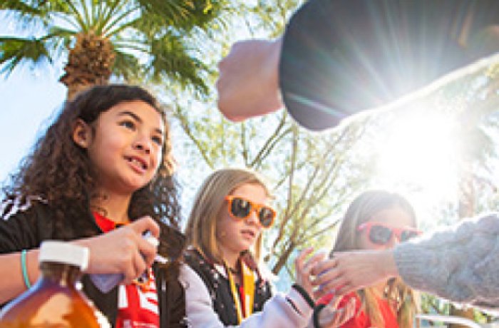 group of kids at an interactive booth at Connect2STEM