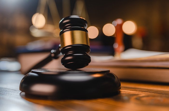 A gavel sits atop a judge's bench