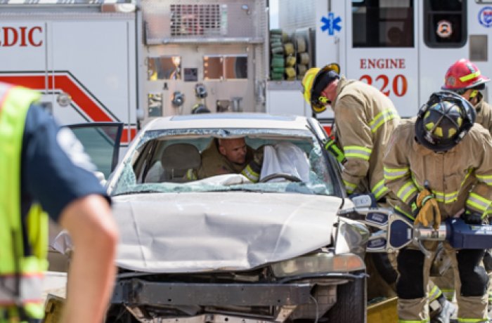 Firefighters Work the 'Jaws of Life' on a Damaged Motor Vehicle