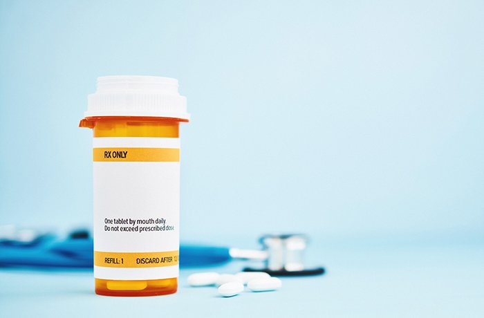 A pill bottle and a stethoscope