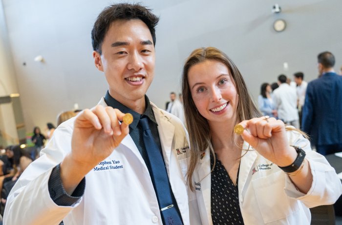 Medical students Stephen Yao and Liane Ruddy proudly display their GHHS pins.