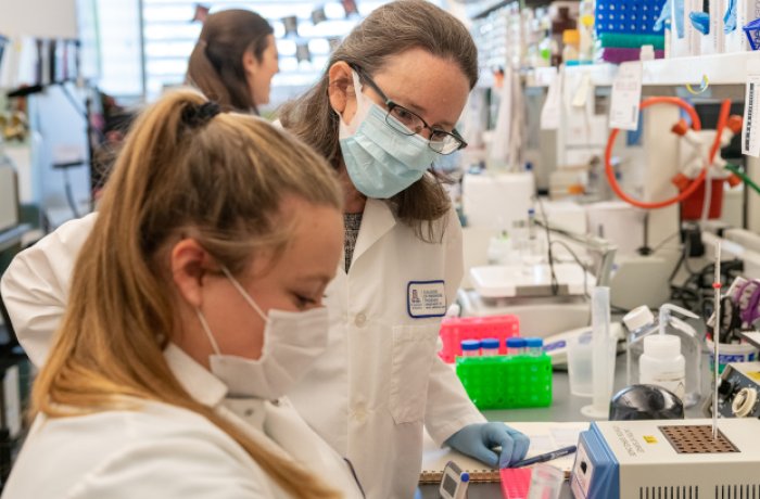 Taben Hale, PhD, with a Research Assistant in Her Lab