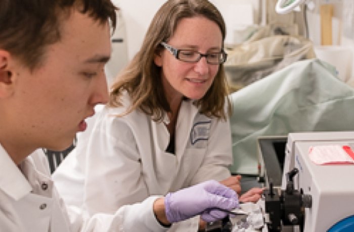 Taben Hale, PhD working in a lab