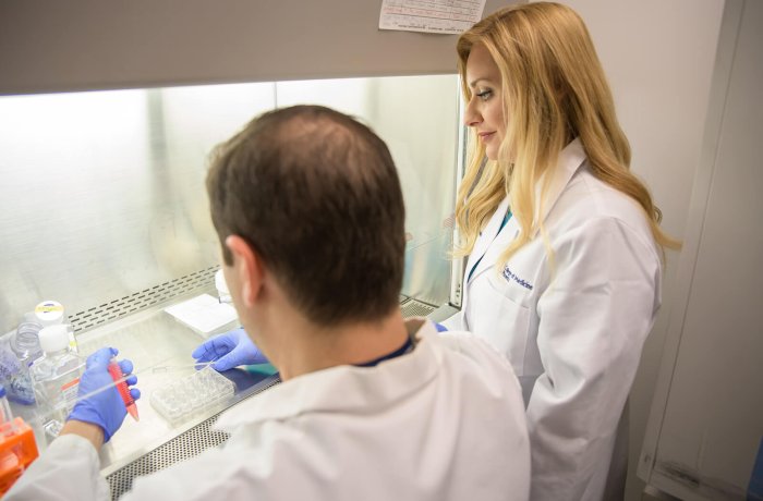 Melissa Herbst-Kralovetz, PhD, overseeing some work in the lab