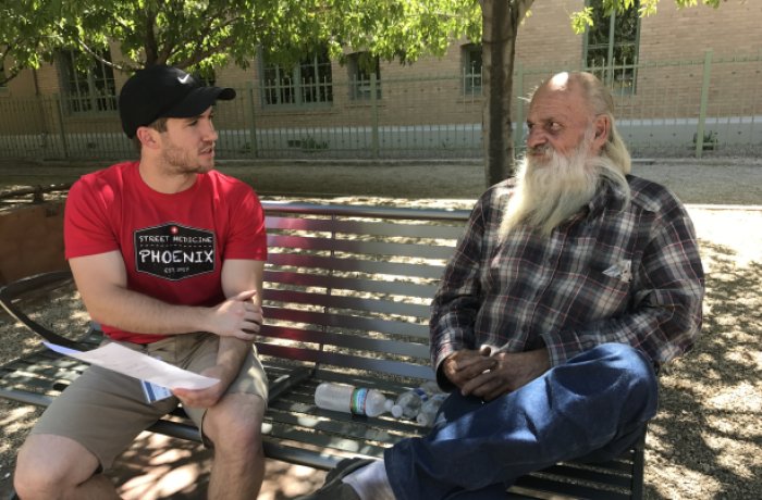 Justin Zeien Working with One of Phoenix's Homeless