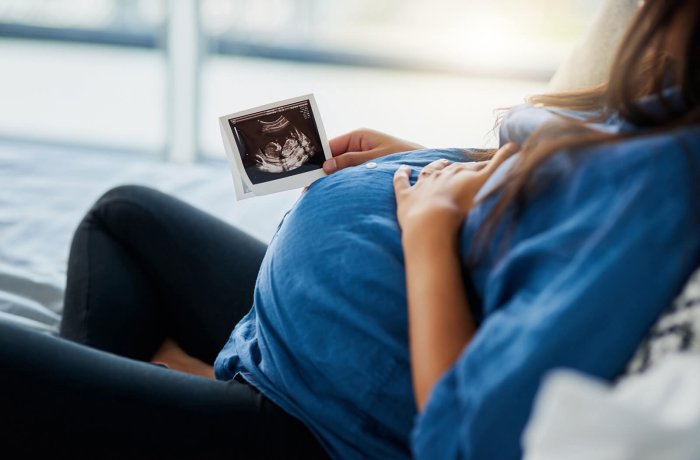 An Expecting Mother Looks at the Ultrasound during a Prenatal Appointment