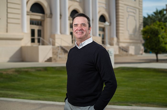 Paul Standley, PhD, Stands in Front of Historic Building 2 on the Phoenix Biomedical Campus