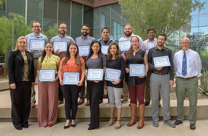 Graduates of the Fellowship Stand with Their Certificates