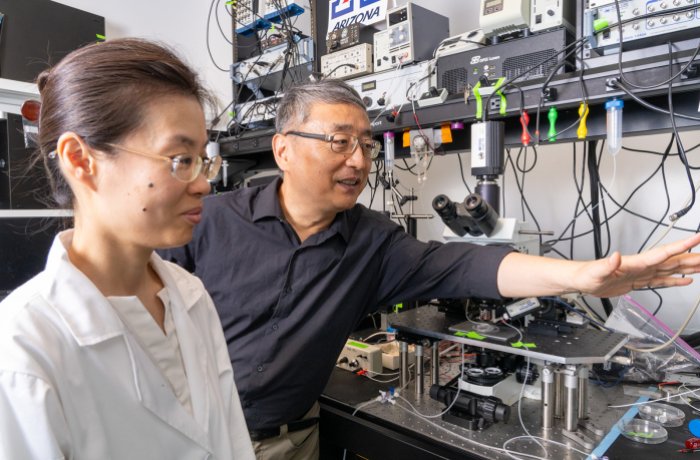 Shenfeng Qiu, PhD, and Jing Wei, a research scientist, in the lab