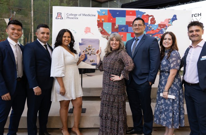 Jesus Sandoval and Valeria Vasquez with fellow medical students at Match Day 2022