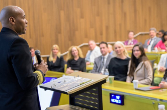 United States Surgeon General Vice Admiral Jerome M. Adams, MD, MPH speaking during Grand Rounds