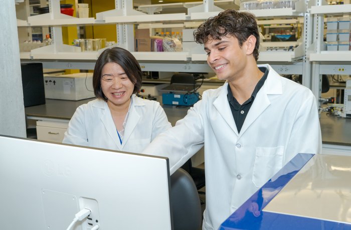Evan Swarup (right) interned in the lab of Hongyu Qiu, MD, PhD.