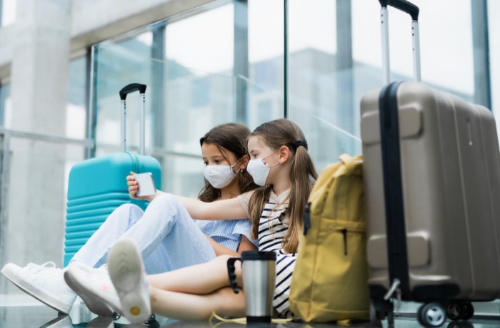 Kids traveling while wearing masks