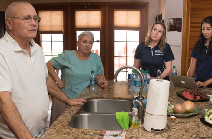 Students at Their Mentors Home in the Kitchen