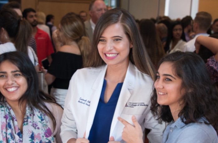 A Medical Student Poses with Her Family at the White Coat Ceremony