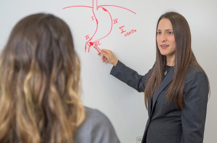 Jennifer Preston, MD, FACS, instructs a medical student in the Center for Simulation and Innovation