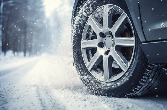 A car tire on a snowy road