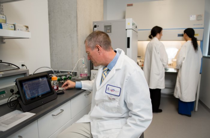 Frederic Zenhausern, PhD, working in lab