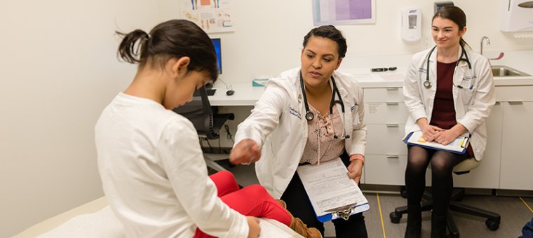 Students in the Doctoring Suite with a Pediatric Patient