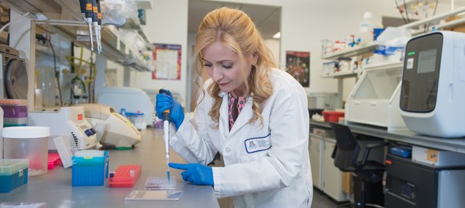 Dr. Herbst-Kralovetz Working in Her Lab Dr. Herbst-Kralovetz Working in Her Lab